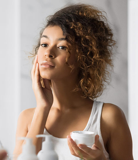 Model showcasing beauty routine Model applying skincare product
