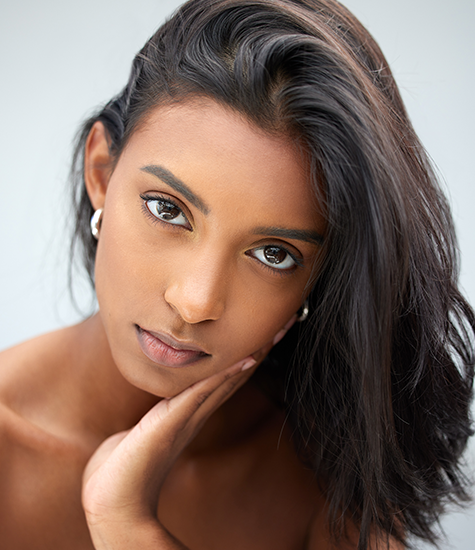 Stunning model showcasing elegance Model in thoughtful pose