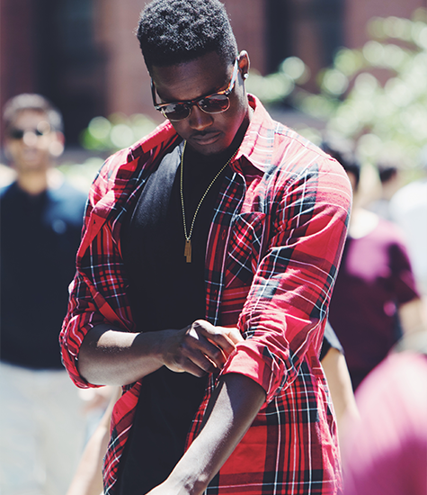Trendy look from a fashion model Model in stylish plaid shirt